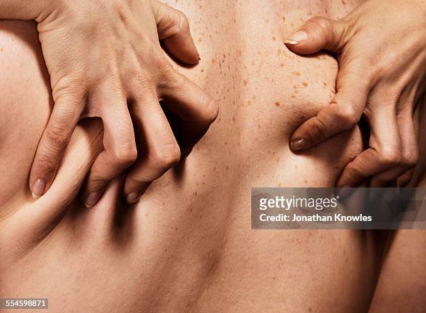 female hands gripping man's back, close up - man desire stock pictures, royalty-free photos & images