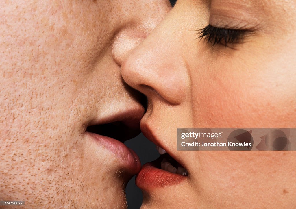 Man and woman about to kiss