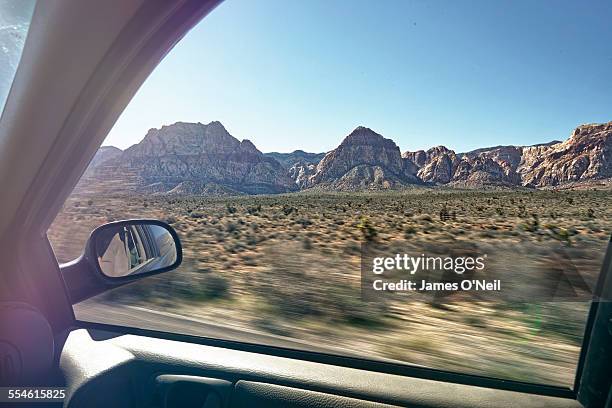 speeding landscape from car window - car window stockfoto's en -beelden