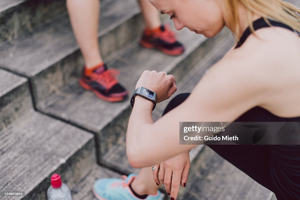 Woman checking smartwatch