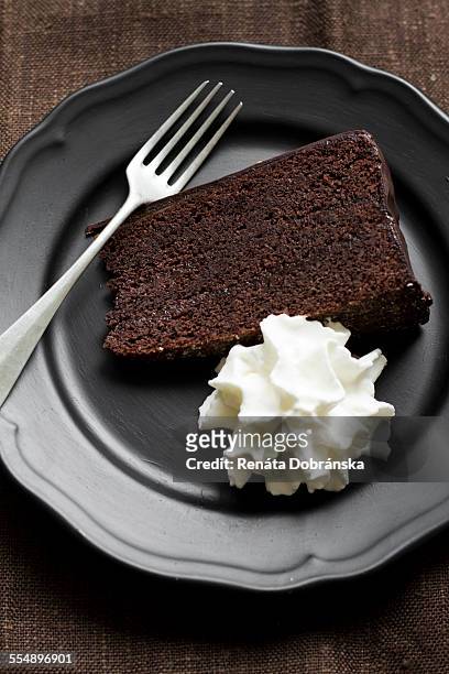 piece of sacher torte with cream - sachertorte stock pictures, royalty-free photos & images