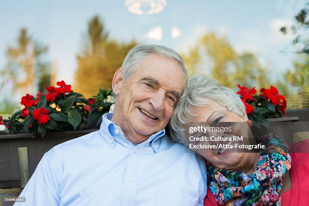 Portrait of smiling senior couple in garden