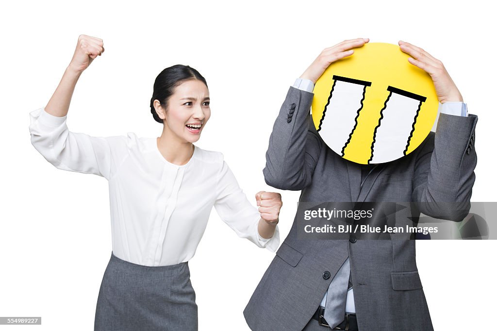 Young businesswoman scolding businessman