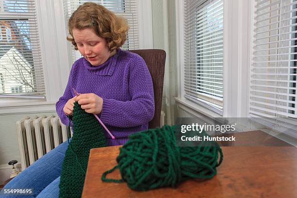 young woman with autism doing her knitting - hemangioma fotografías e imágenes de stock