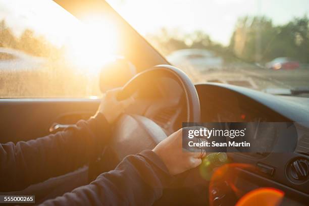 hands of woman on car steering wheel - driver's seat stock-fotos und bilder