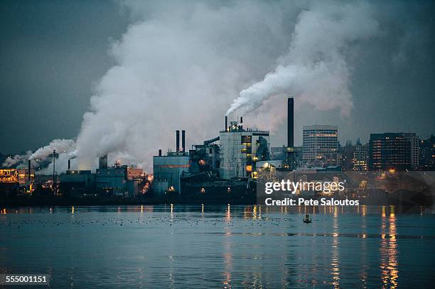 view of industrial plant and smoke stacks at night, tacoma, washington, usa - pollution stock pictures, royalty-free photos & images