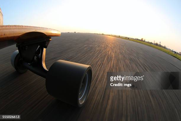 longboarding - longboard surfing stock pictures, royalty-free photos & images