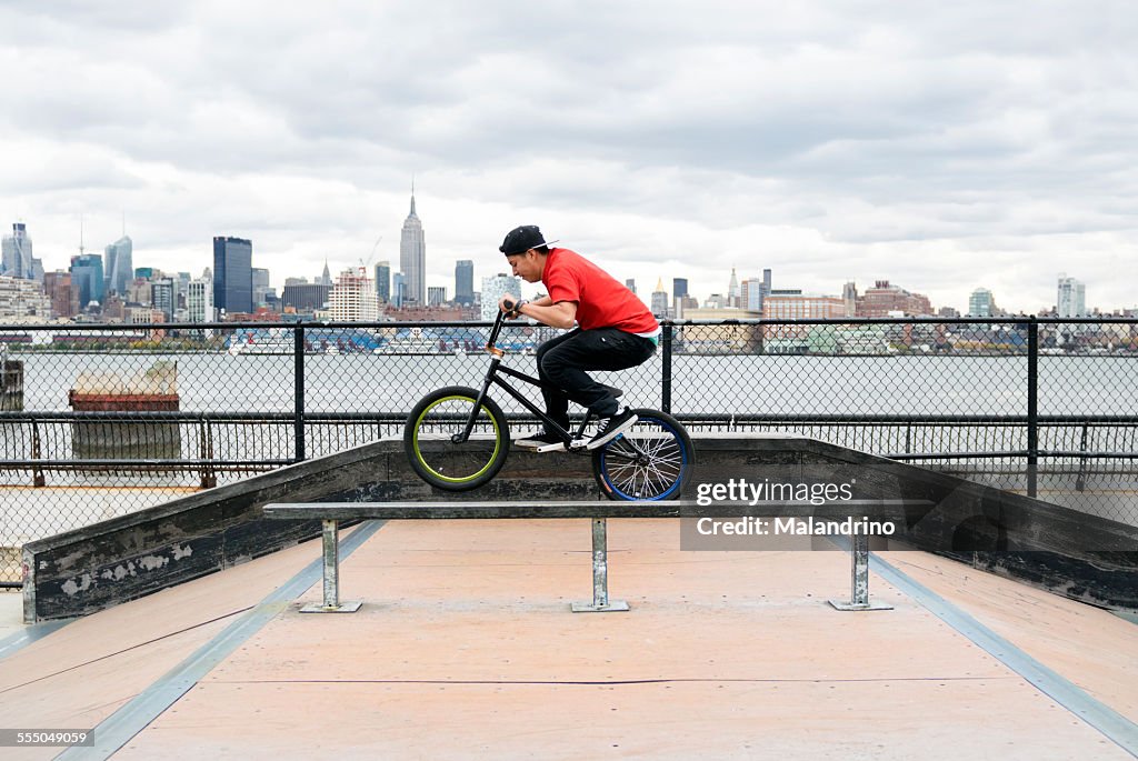 Teenage boy riding a BMX Bike near NYC