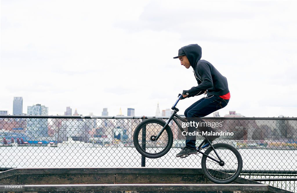 Teenage Boy riding a BMX Bike