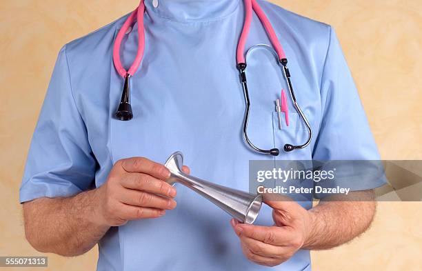 obstetrician/gynaecologist with pinard stethoscope - gynaecologist stock pictures, royalty-free photos & images