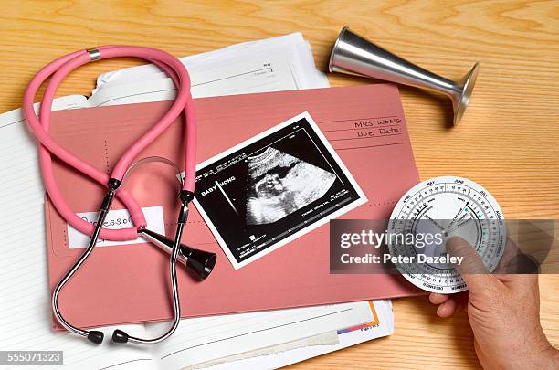 obstetrician/gynaecologist desk - foetus stock pictures, royalty-free photos & images