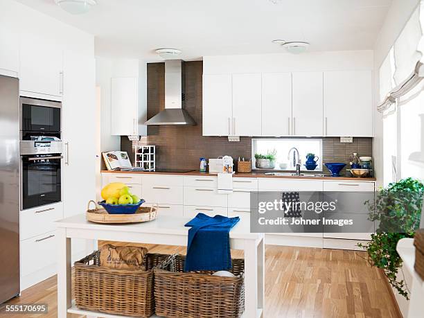 modern kitchen - kitchen island stock pictures, royalty-free photos & images