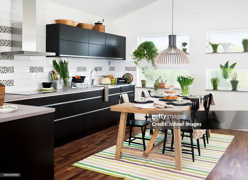 Modern kitchen with dining table