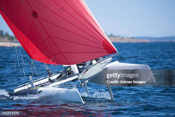 sailing in the archipelago - catamaran waves stock pictures, royalty-free photos & images