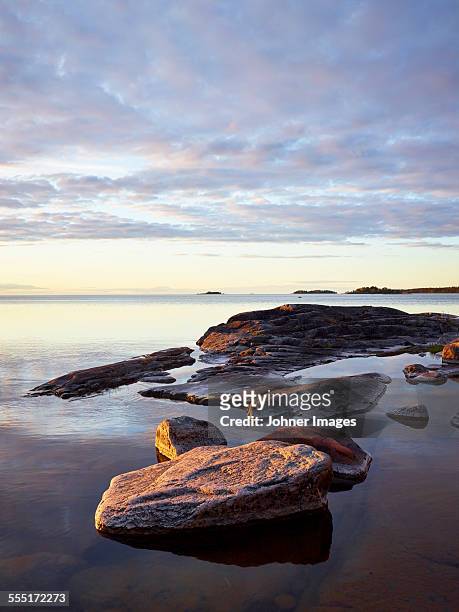 rocks in water - archipelago stockfoto's en -beelden