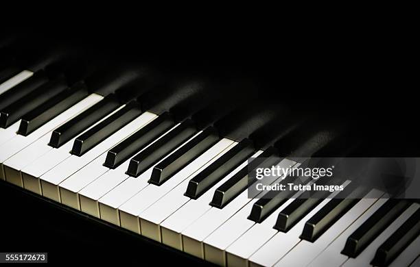 close-up of piano keys - klavier stock-fotos und bilder
