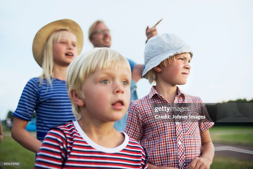 Father with three children, selective focus