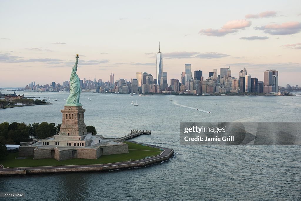 USA, New York State, New York City, Aerial view of Statue of Liberty and city skyline