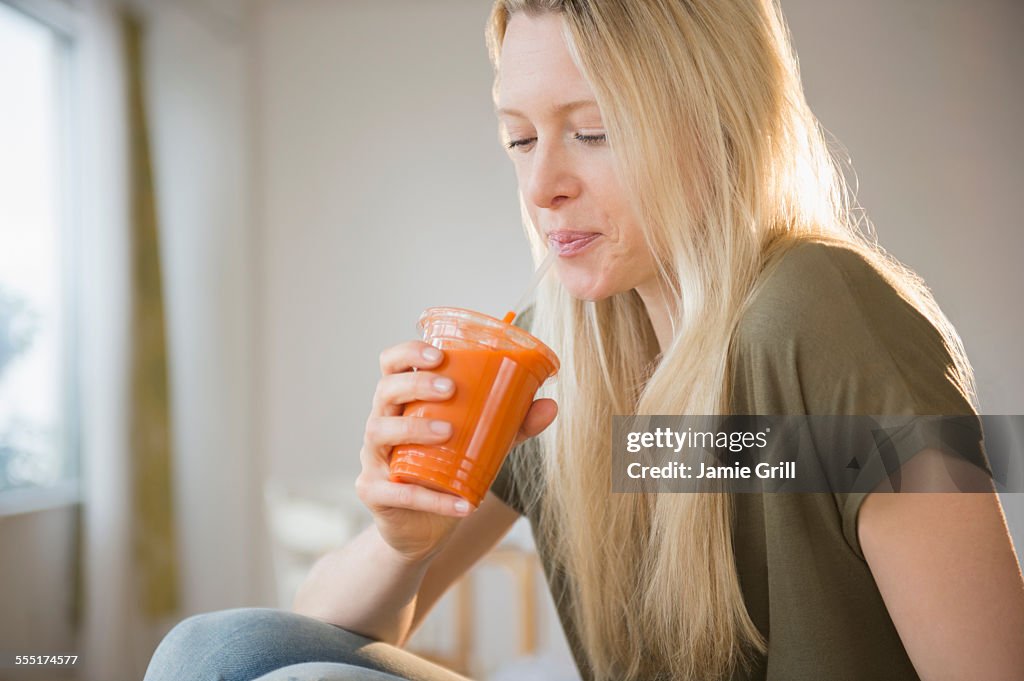 Jersey City, Woman drinking carrot juice