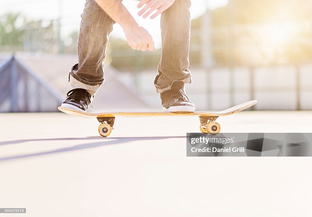 USA, Florida, West Palm Beach, Man skateboarding in skatepark