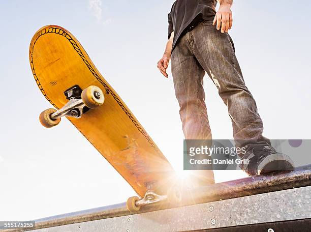 usa, florida, west palm beach, man with skateboard at the edge of ramp - ハーフパイプ ストックフォトと画像