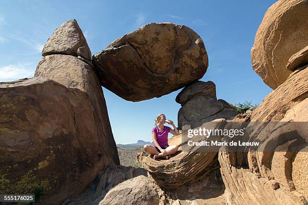 usa, texas, big bend national park grapevine hills, woman visiting balanced rock  - grapevine texas stock pictures, royalty-free photos & images