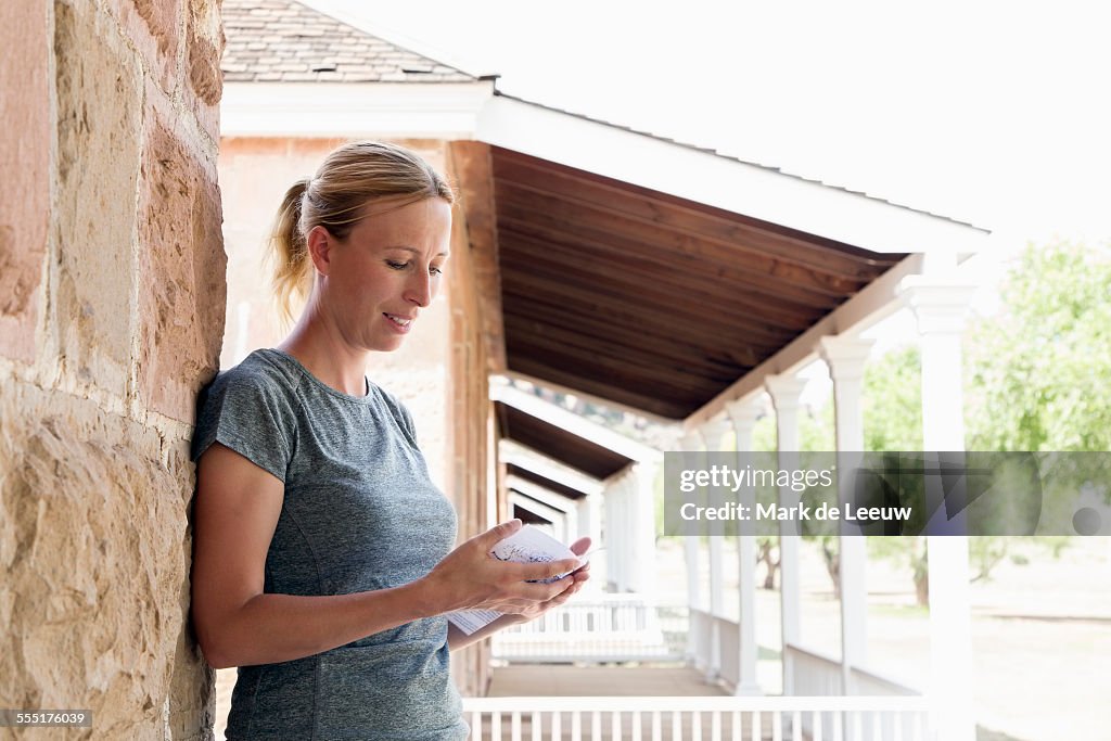 USA, Texas, Fort Davis National Historic Site, Woman looking at map