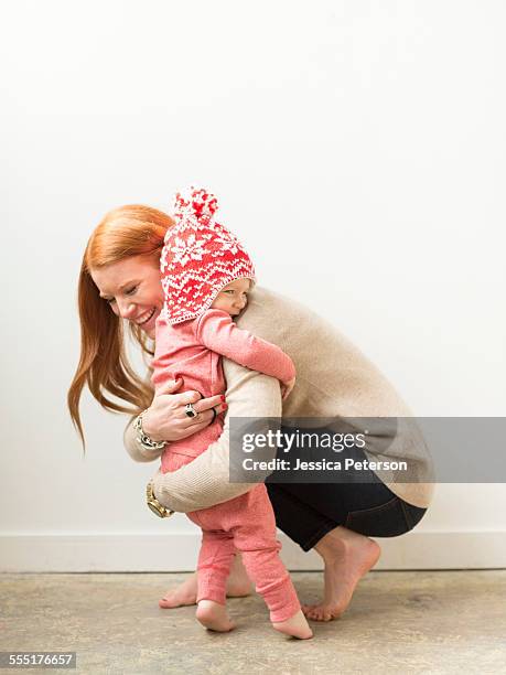 mother embracing baby son (2-3) - barefoot redhead ストックフォトと画像