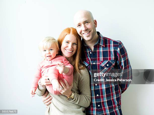 family with baby son (2-3) - couples studio portrait stock pictures, royalty-free photos & images