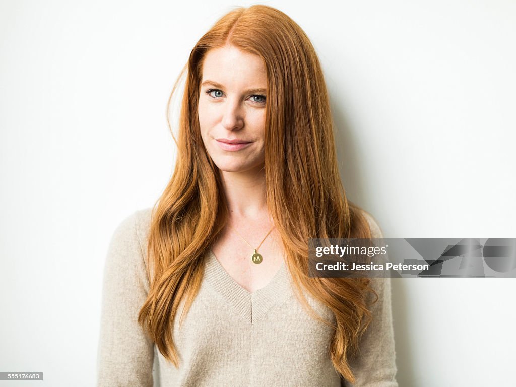 Portrait of woman with long red hair