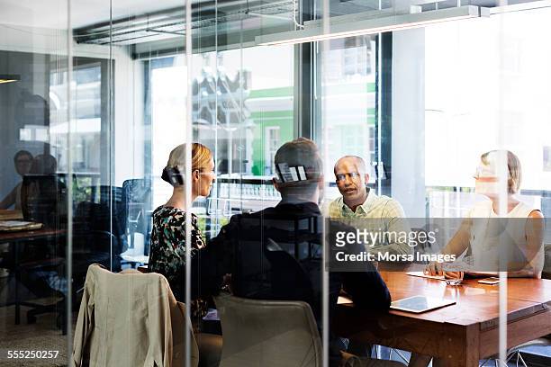 business people discussing in board room - quartet stock pictures, royalty-free photos & images