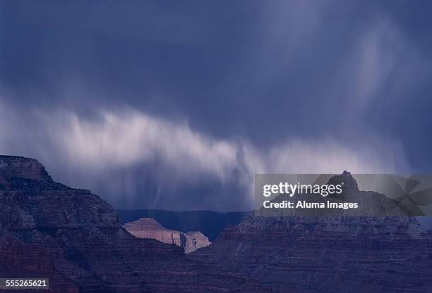 rain squall over grand canyon - squall stock pictures, royalty-free photos & images