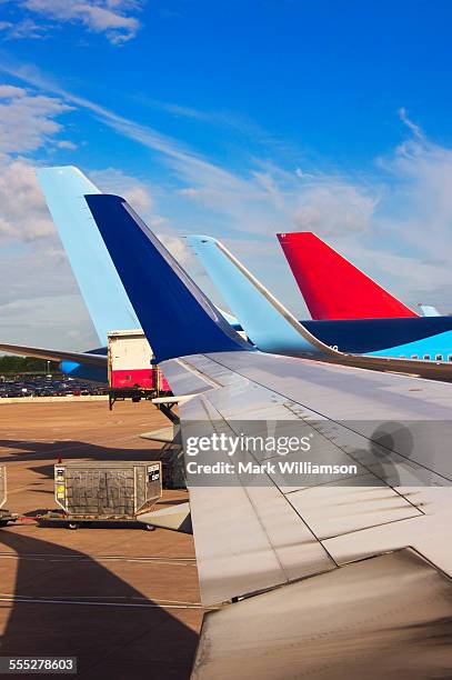 wings and tails. - manchester airport stock pictures, royalty-free photos & images