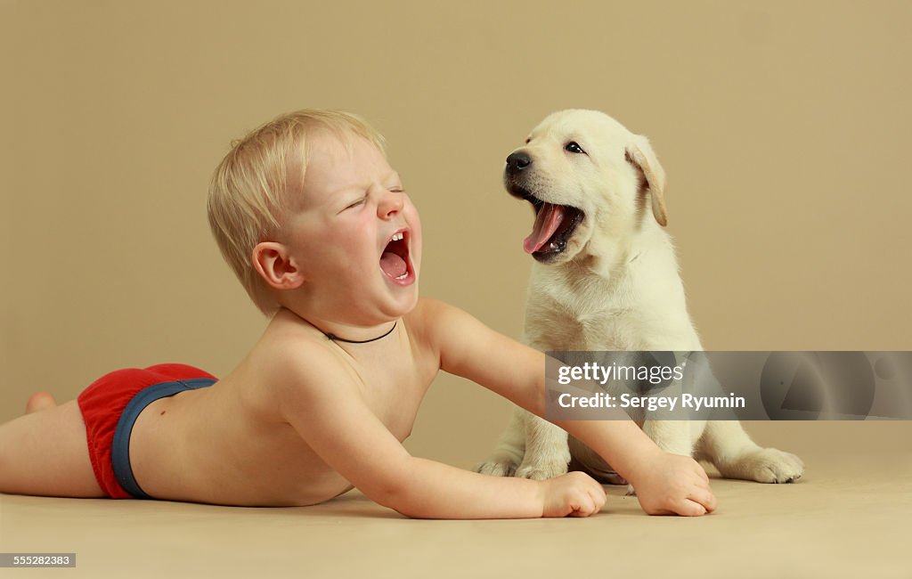 Baby and puppy. The duet.