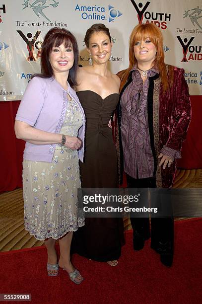 Singer Naomi Judd poses with her daughters actress Ashley Judd and singer Wynonna Judd on the red carpet during the annual YouthAIDS Benefit Gala...