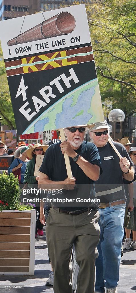 KXL pipeline opponent marching with sign.