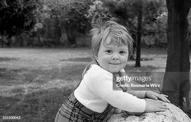 fototrove!  baby boy in garden - ambivere stock pictures, royalty-free photos & images