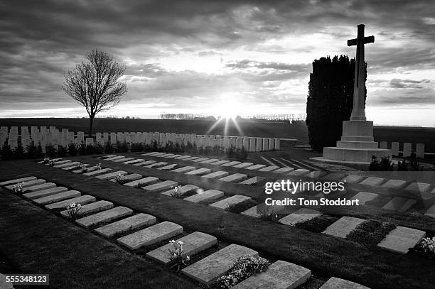 Sunrise at Mill Road Cemetery, Thiepval, Somme, France. Mill Road Cemetery contains 1,304 graves all of soldiers from the United Kingdom. There are...