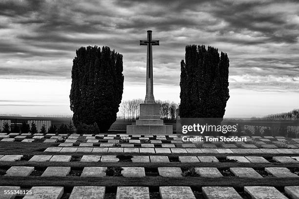 Sunrise at Mill Road Cemetery, Thiepval, Somme, France. Mill Road Cemetery contains 1,304 graves all of soldiers from the United Kingdom. There are...