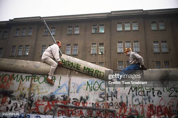 Two men dismantle part of the Berlin Wall near Checkpoint Charlie on November 10 the day the Wall fell.