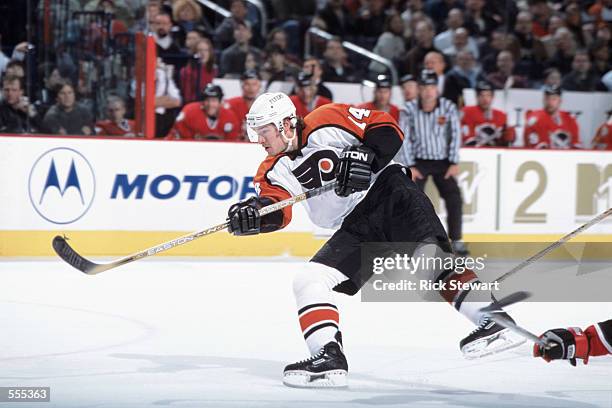 Right wing Justin Williams of the Philadelphia Flyers hits the puck during the NHL game against the Buffalo Sabres at the HSBC Arena in Buffalo, New...