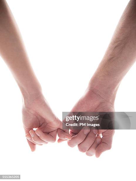 couple holding hands - little finger stock pictures, royalty-free photos & images
