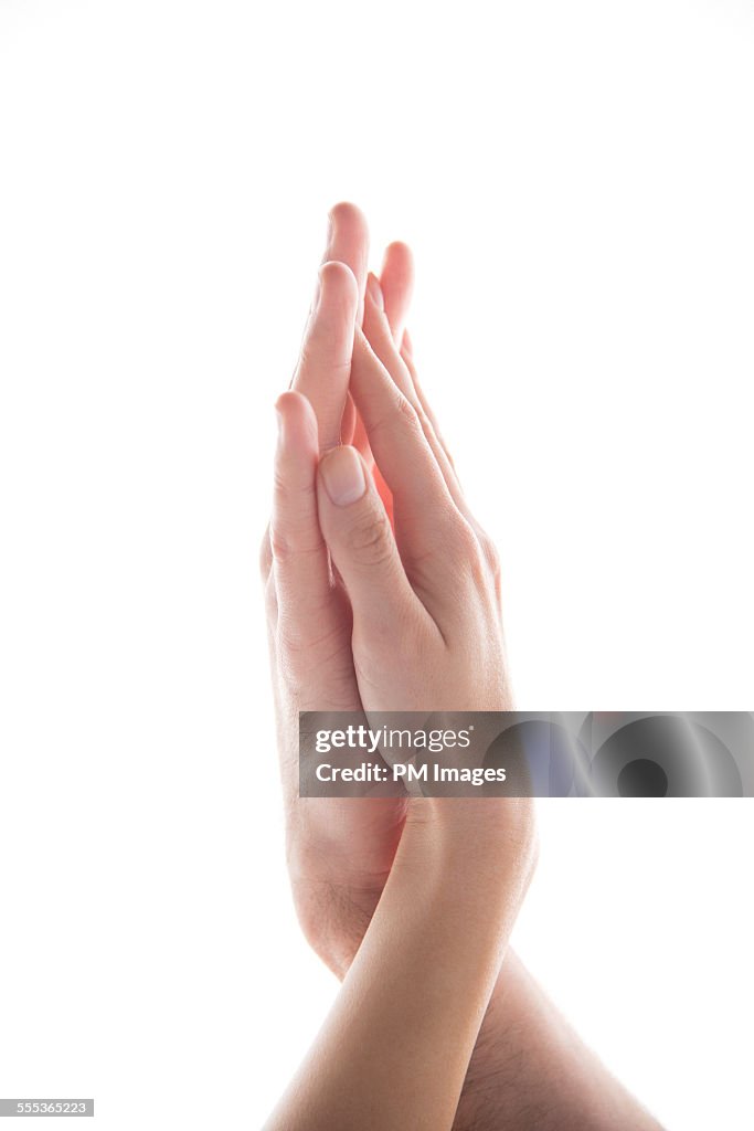 Couple's hands touching