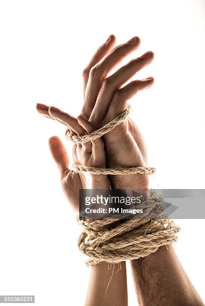 hands bound together - couple trapped stock pictures, royalty-free photos & images