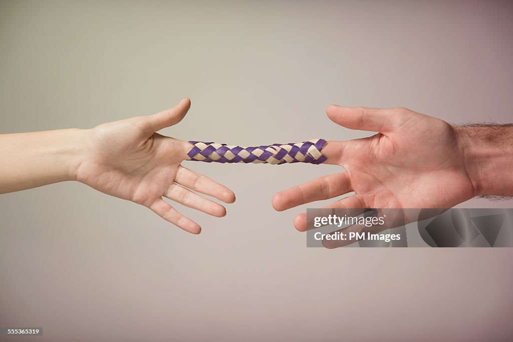 Chinese Finger Trap High-Res Stock Photo - Getty Images