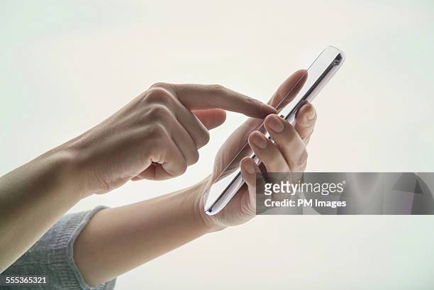 woman using smart phone - smart phone on white stock pictures, royalty-free photos & images