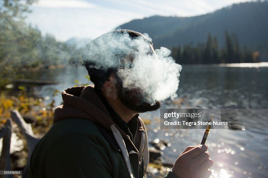 Man smoking with a vape pen