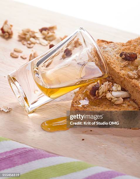 honey and whole grain - raisin toast stock pictures, royalty-free photos & images