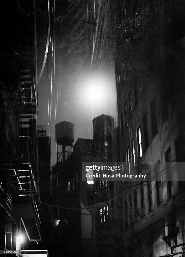 Black and white photo of a dark alley at nigth, NY