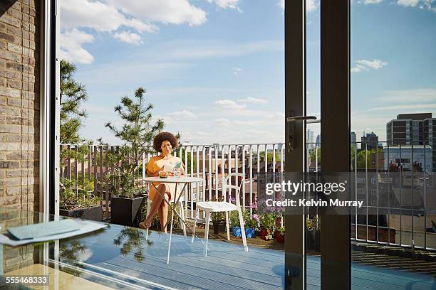 40's couple in apartment - building terrace stock pictures, royalty-free photos & images